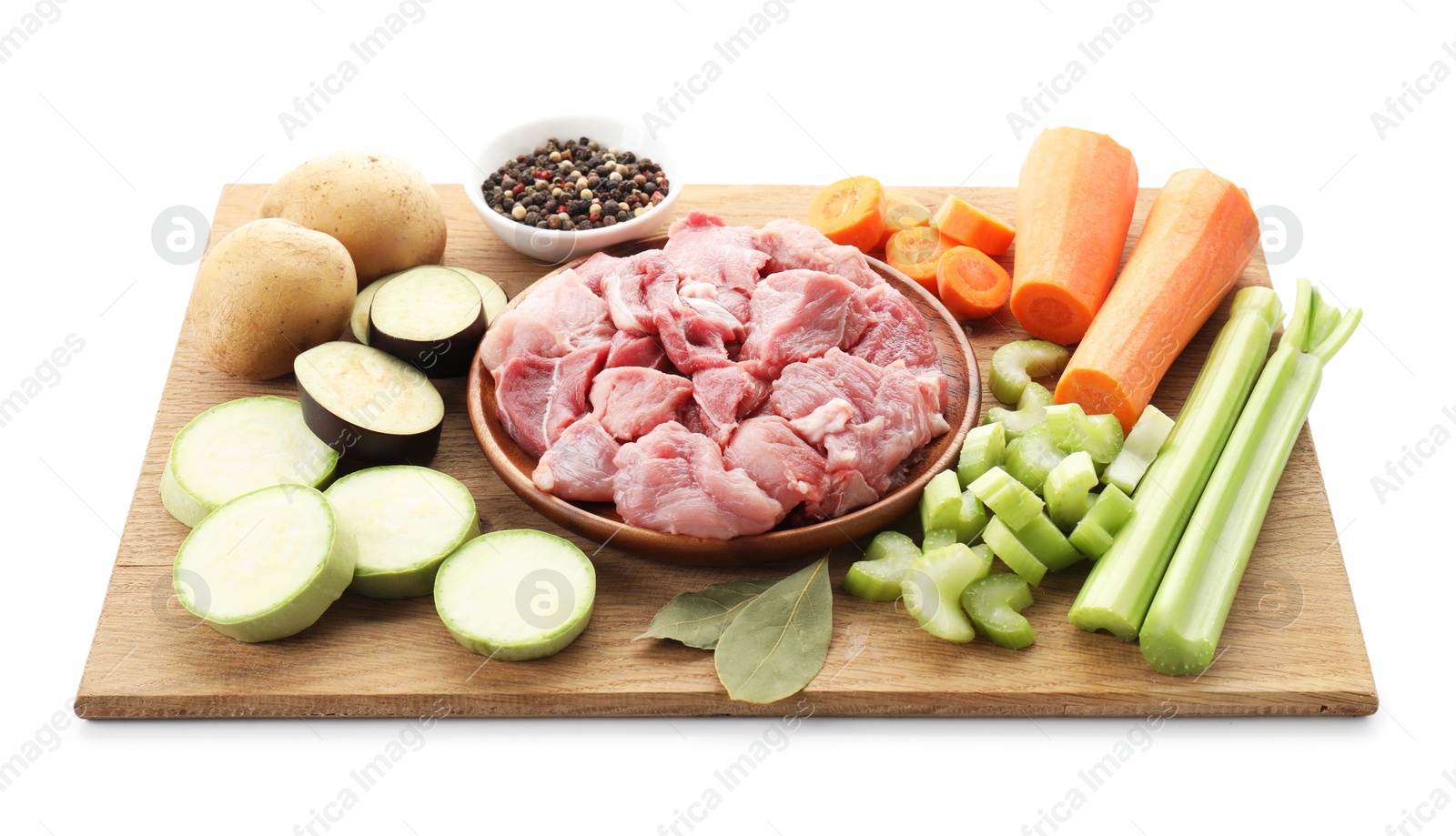 Photo of Cooking stew. Uncooked meat and vegetables isolated on white