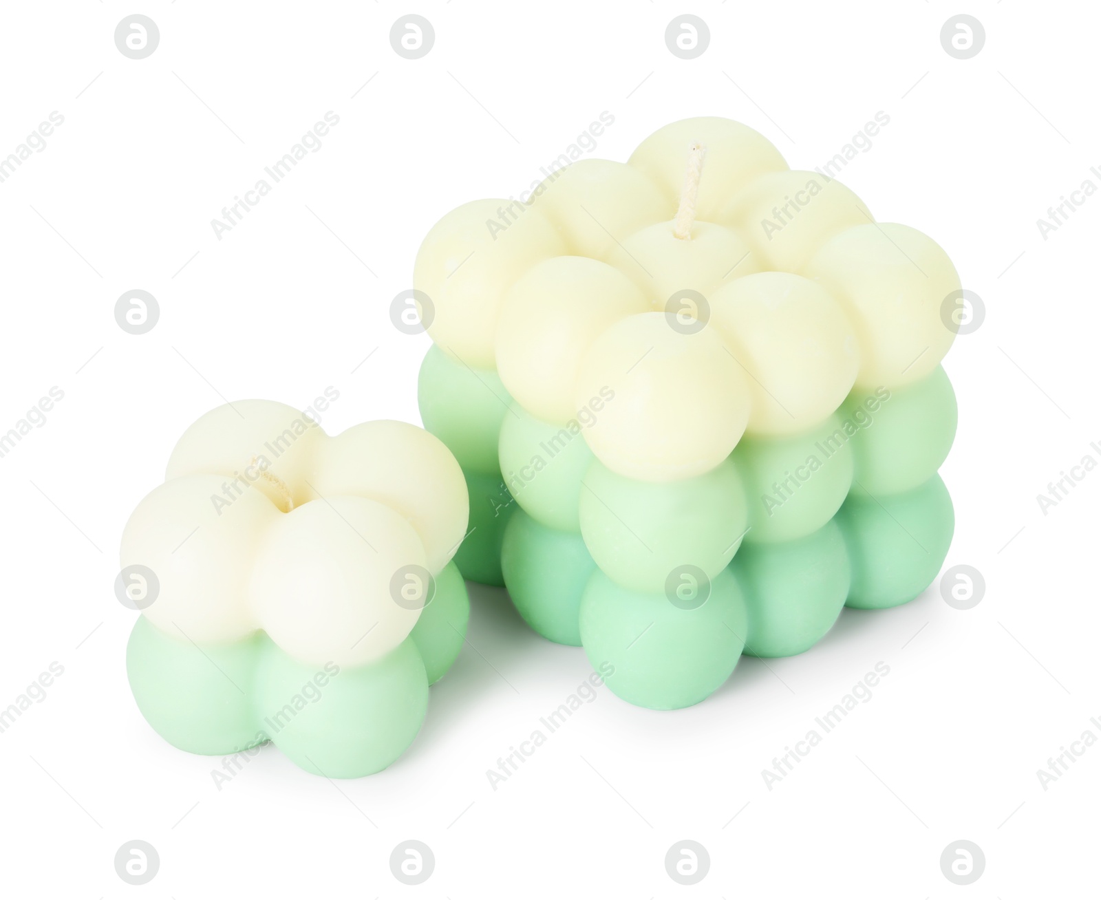 Photo of Two beautiful bubble candles isolated on white