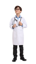 Photo of Boy with stethoscope pretending to be doctor on white background. Dreaming of future profession