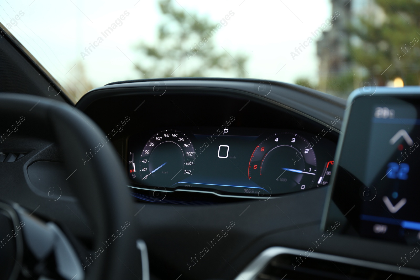 Photo of Speedometer on dashboard inside of modern luxury car, closeup