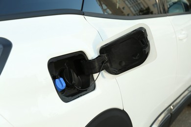 Photo of Closeup view of open car fuel flap