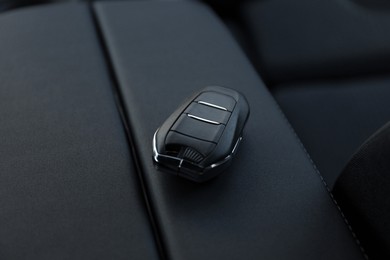 Photo of Car flip key inside of modern automobile, closeup