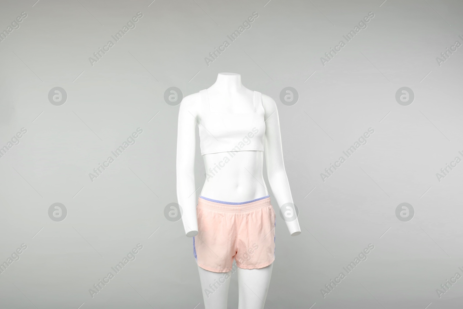 Photo of Female mannequin with stylish sportswear on light background