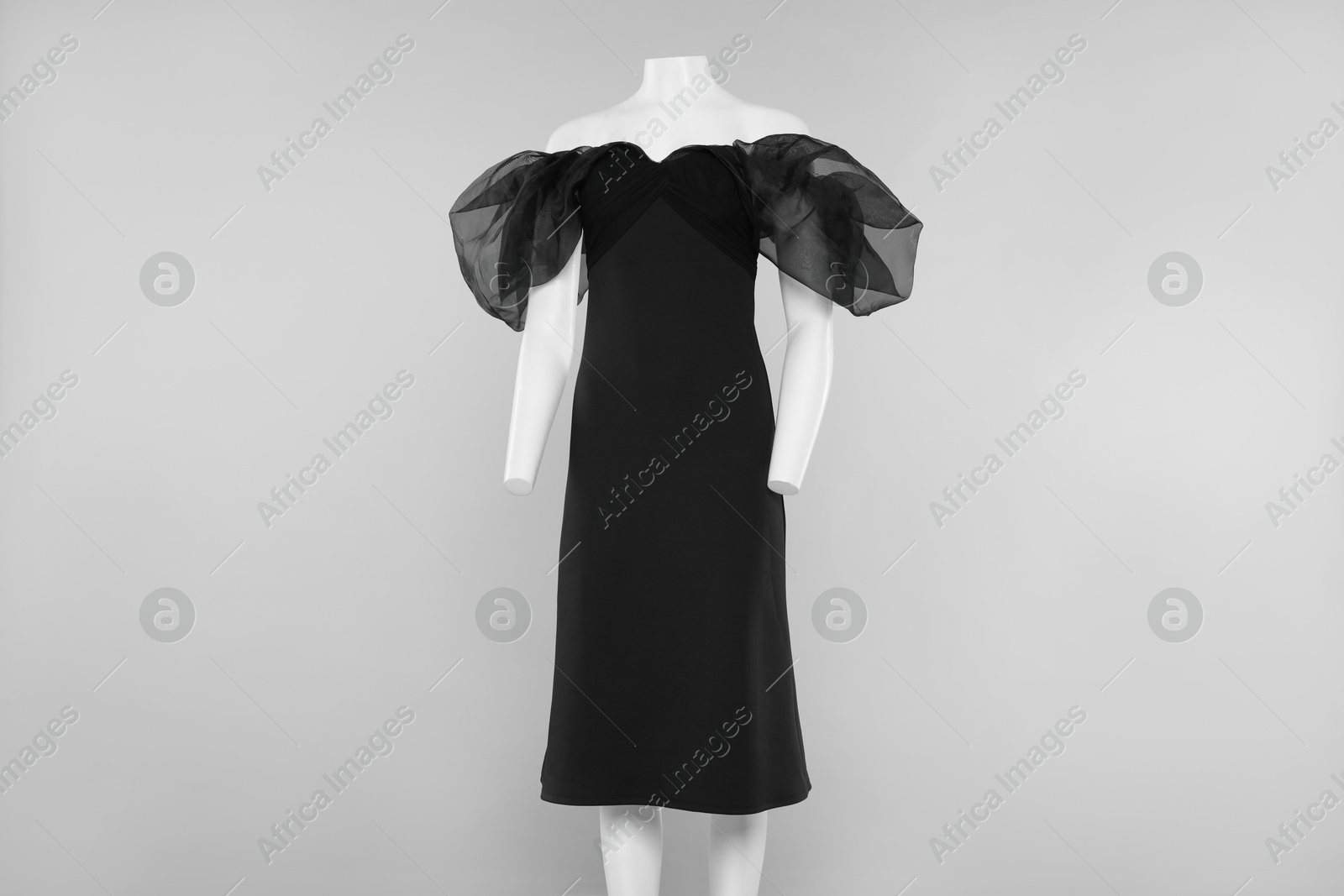 Photo of Female mannequin with stylish outfit on light grey background