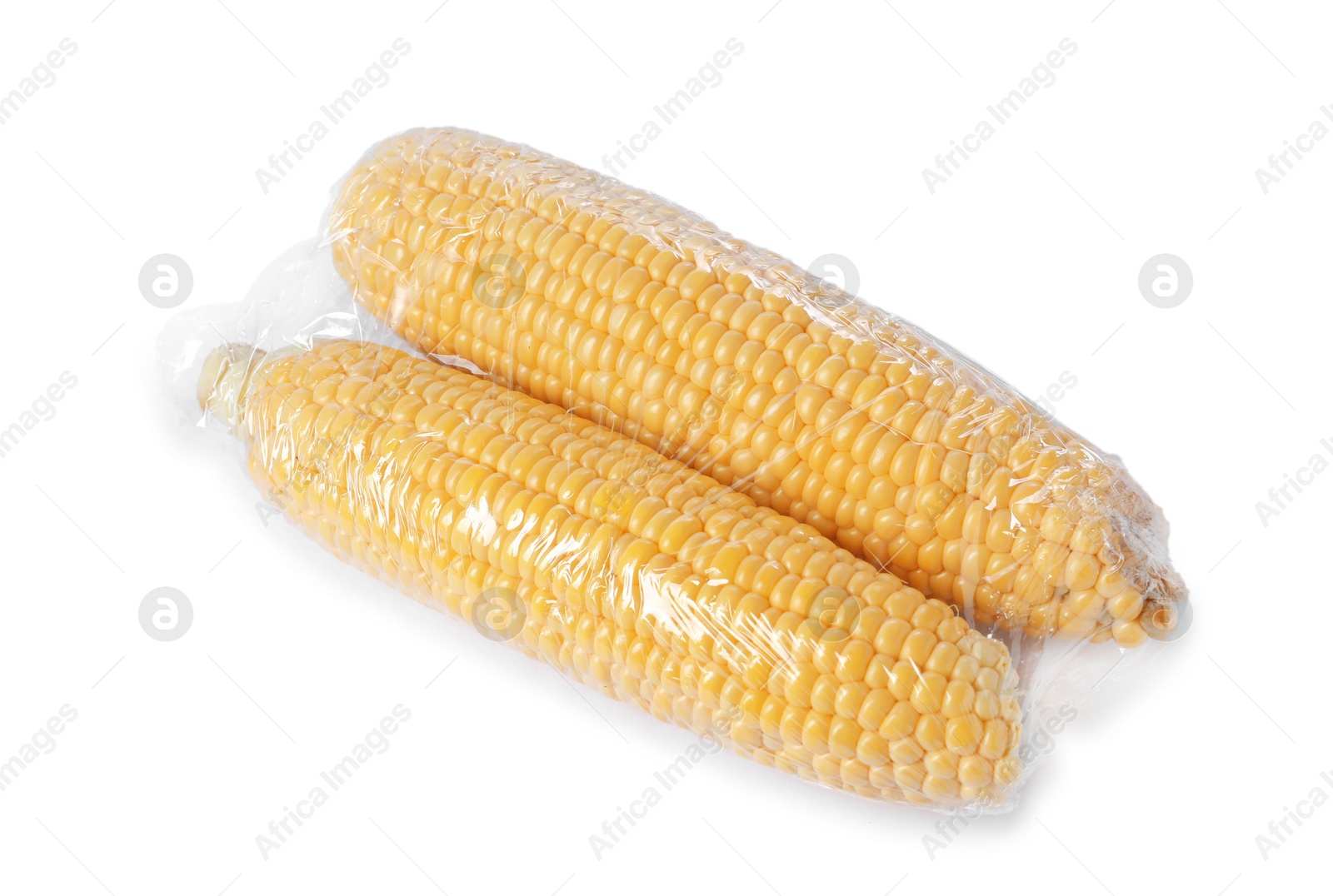 Photo of Fresh corncobs with plastic food wrap isolated on white