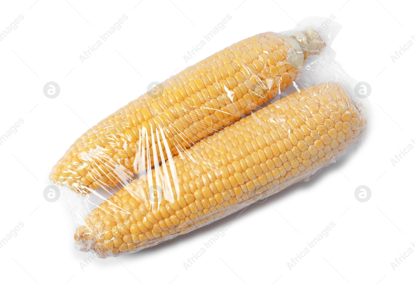 Photo of Fresh corncobs with plastic food wrap isolated on white