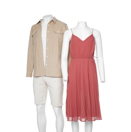 Photo of Female and male mannequins with stylish outfits isolated on white