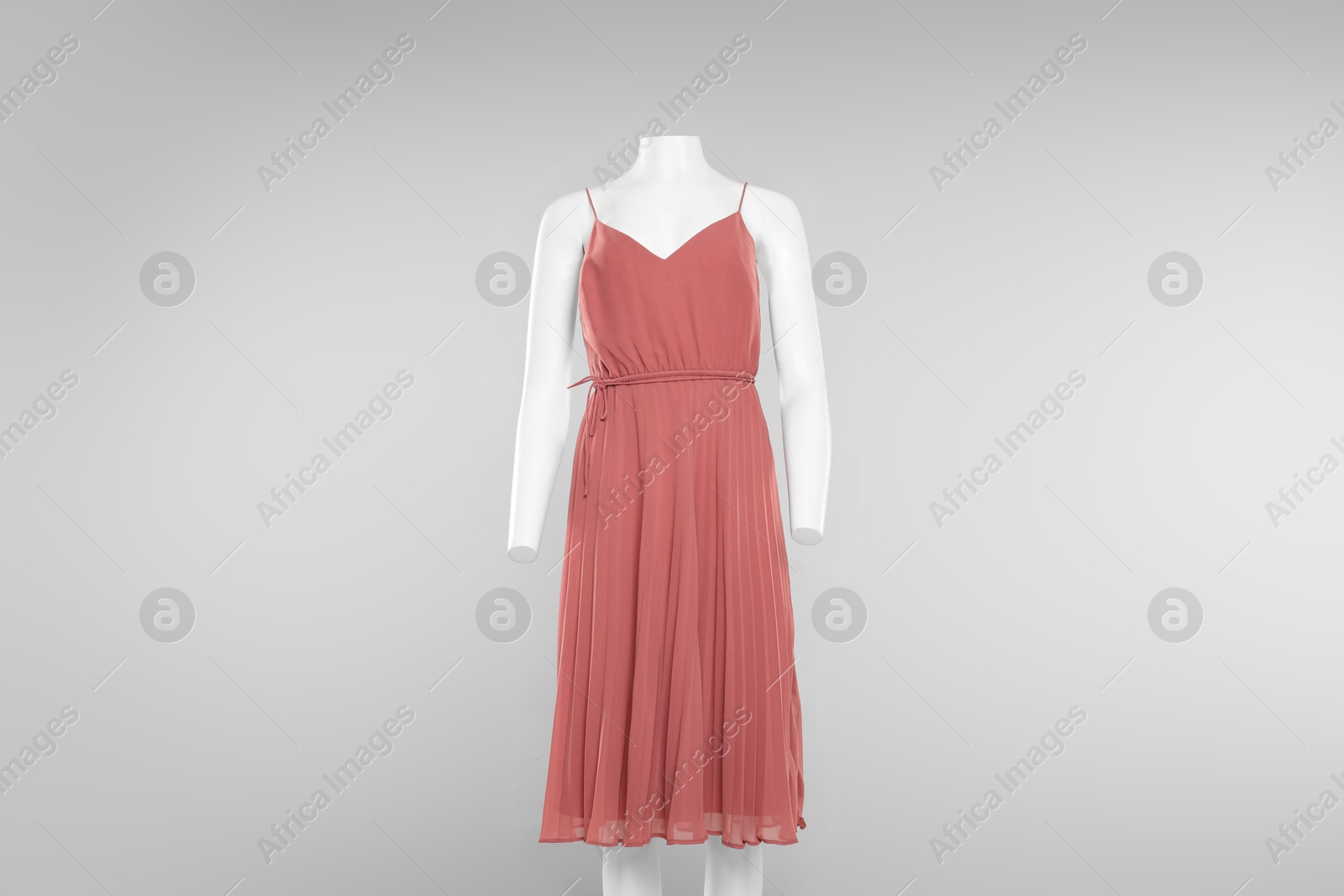 Photo of Female mannequin with stylish outfit on light grey background