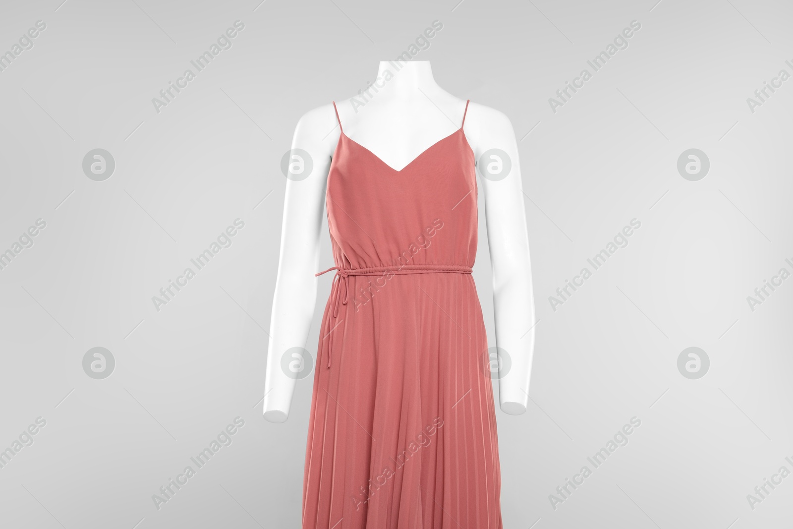 Photo of Female mannequin with stylish outfit on light grey background