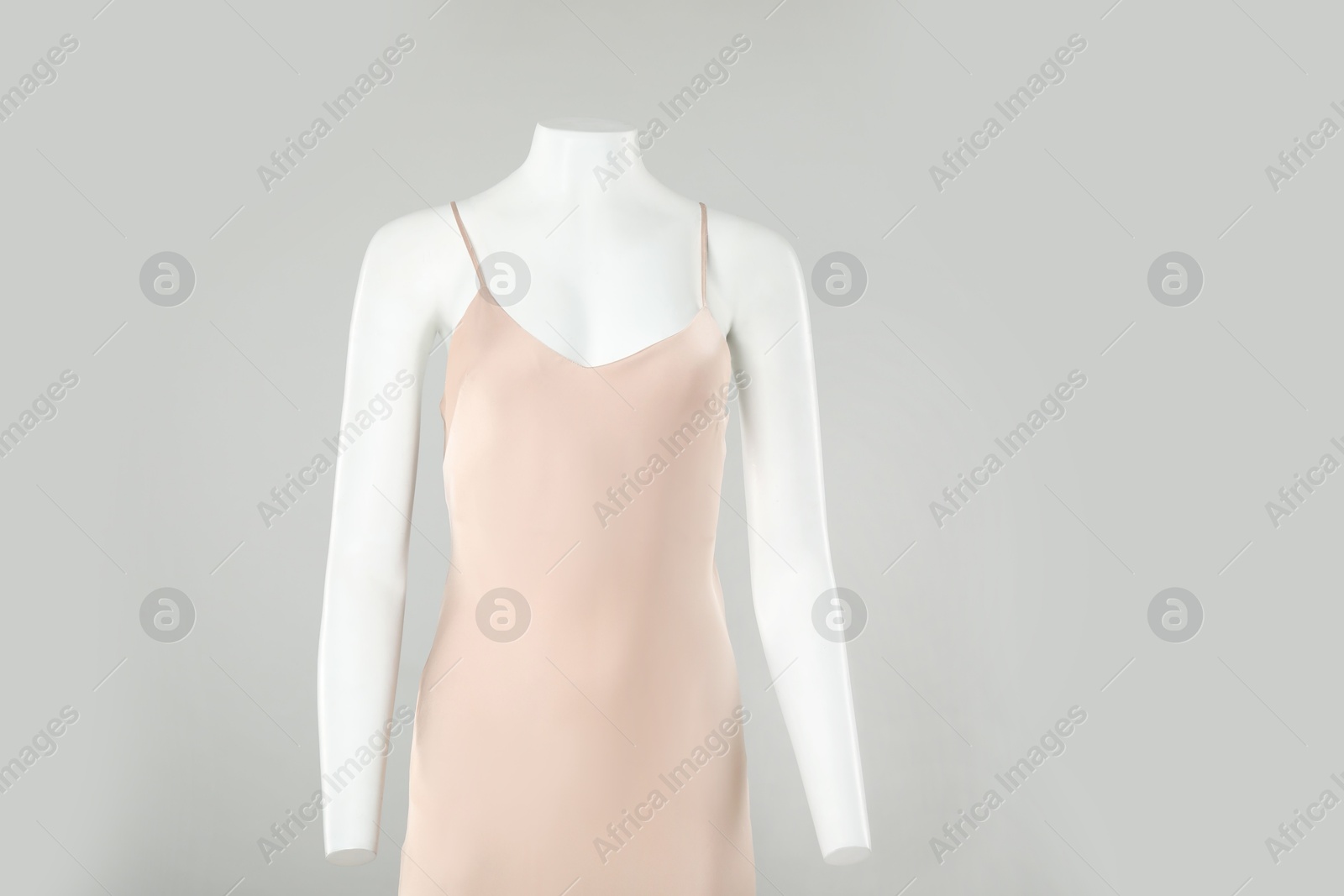 Photo of Female mannequin with stylish outfit on light grey background