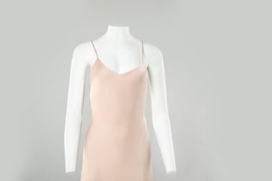 Photo of Female mannequin with stylish outfit on light grey background