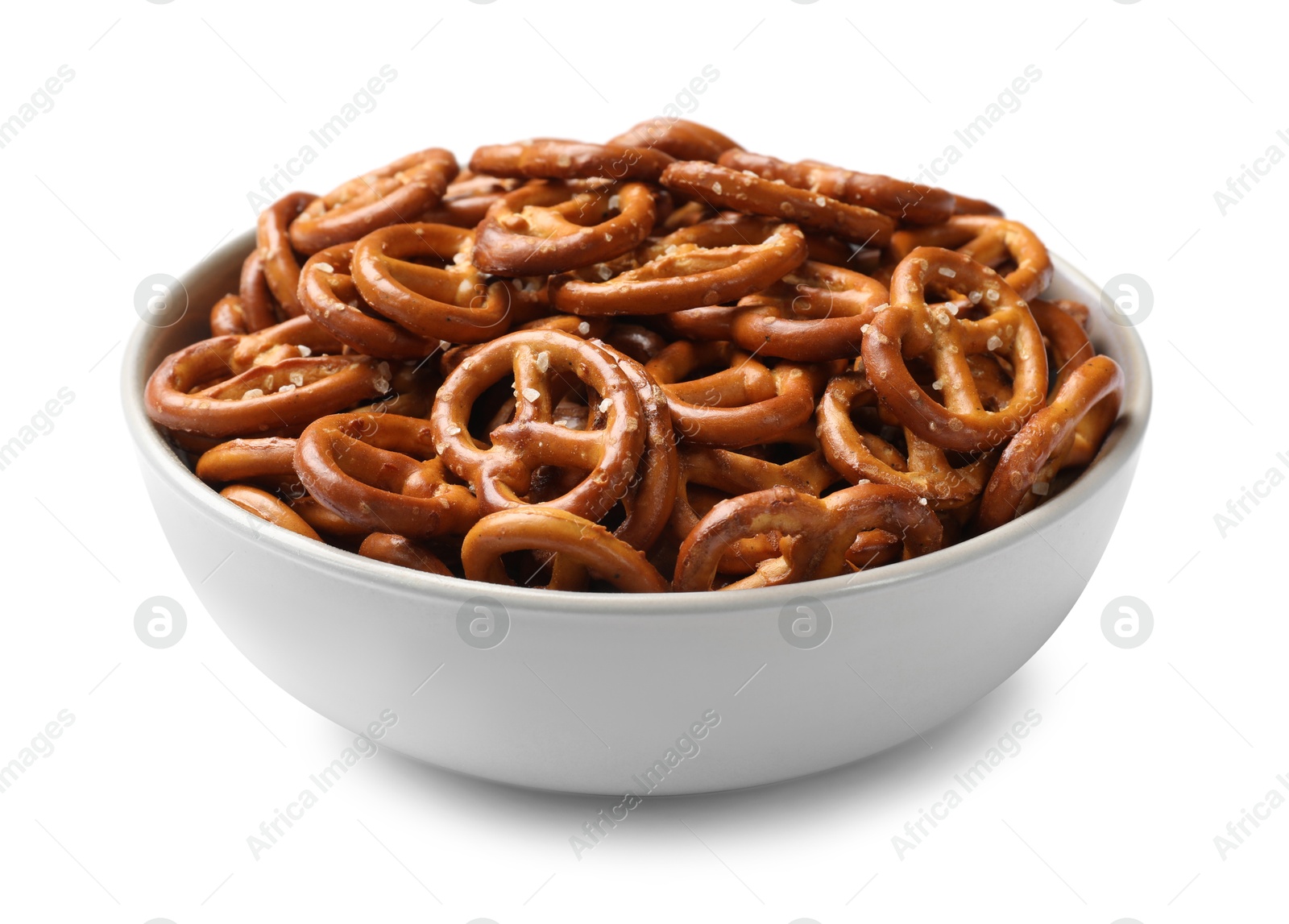 Photo of Delicious pretzel crackers in bowl isolated on white