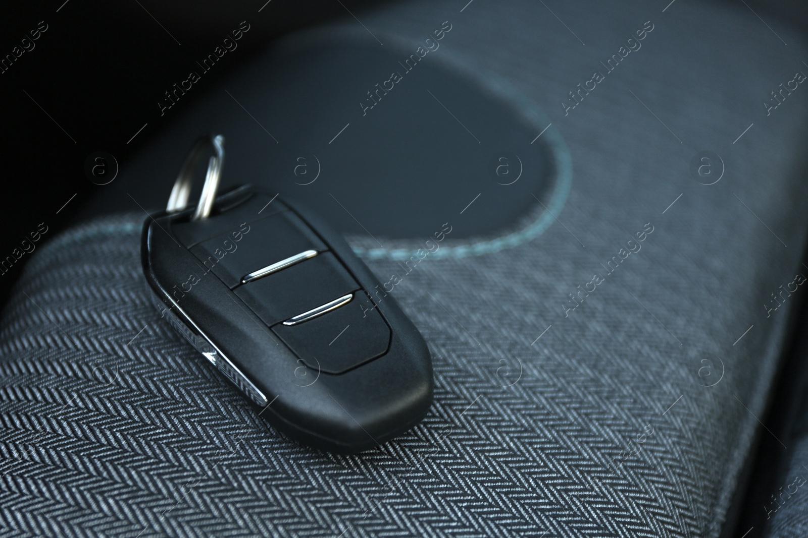 Photo of Car flip key inside of modern automobile, closeup