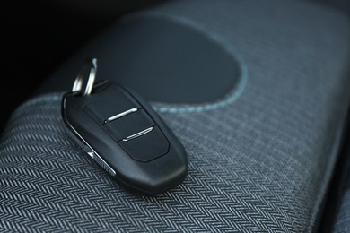 Photo of Car flip key inside of modern automobile, closeup