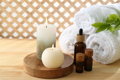 Photo of Composition with cosmetic products for spa treatment on wooden table