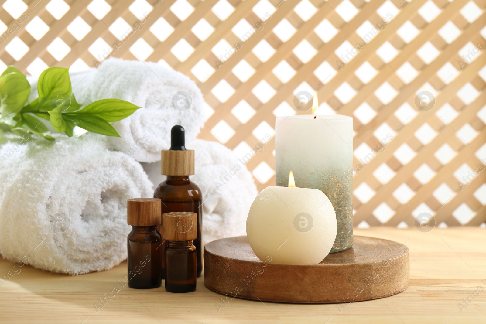 Photo of Composition with cosmetic products for spa treatment on wooden table