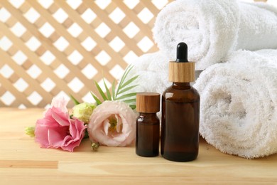 Composition with cosmetic products for spa treatment on wooden table