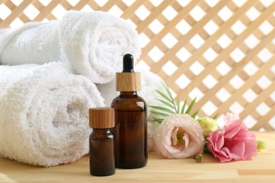 Photo of Composition with cosmetic products for spa treatment on wooden table