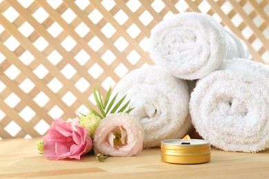 Photo of Composition with cosmetic products for spa treatment on wooden table