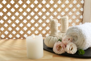 Composition with cosmetic products for spa treatment on wooden table, space for text