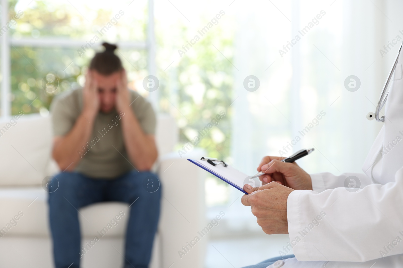 Photo of Overweight man having consultation with nutritionist in clinic, selective focus