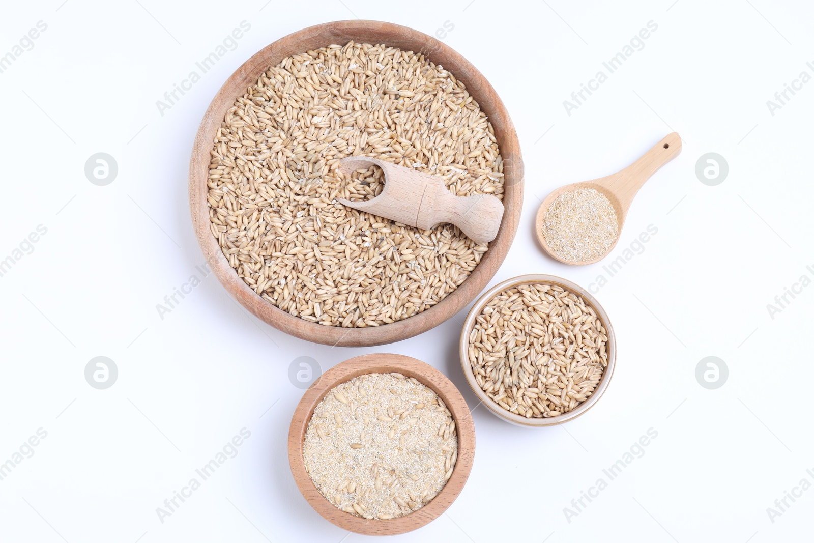 Photo of Oat grains and bran in bowls isolated on white, top view