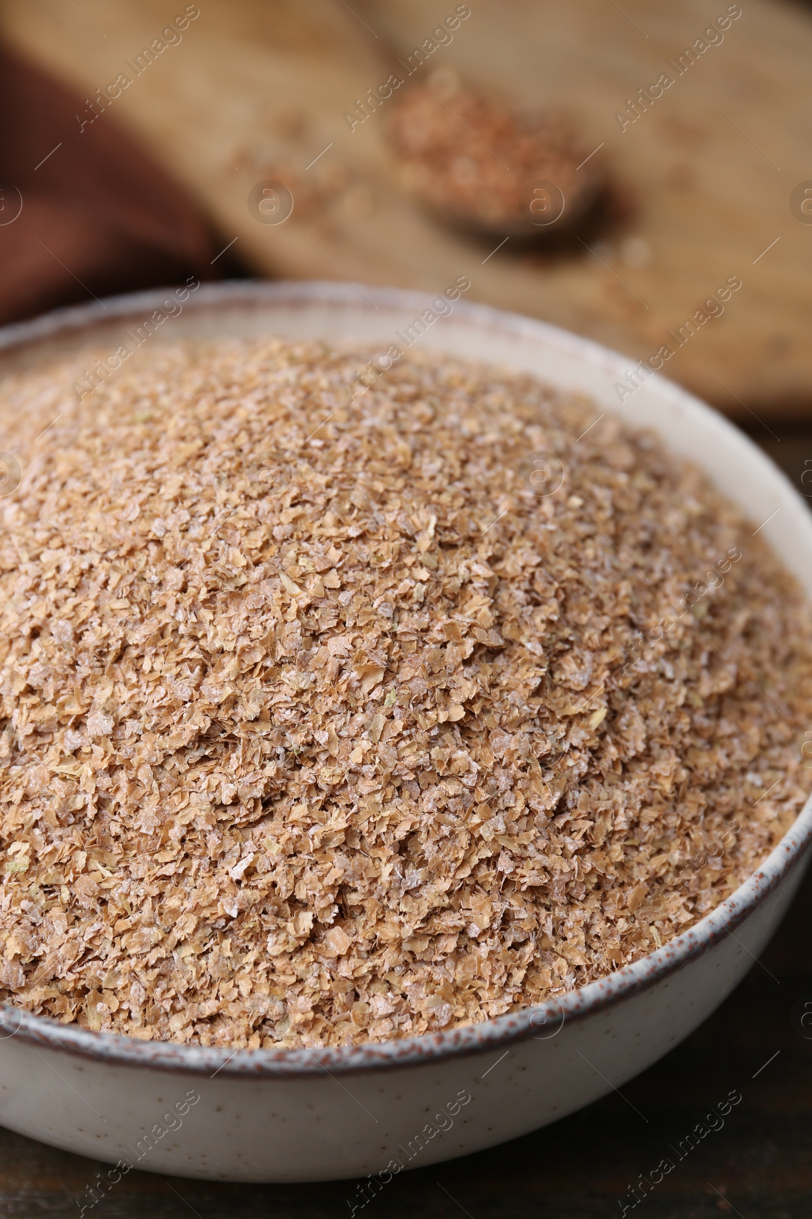 Photo of Buckwheat bran in bowl on table, closeup