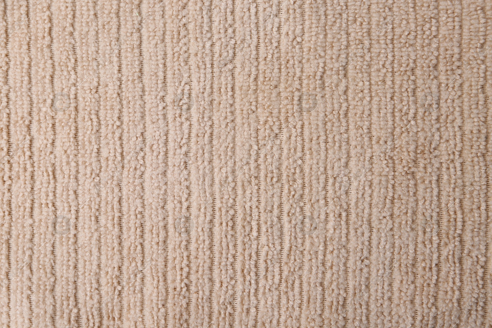 Photo of Clean beige microfiber cloth as background, top view