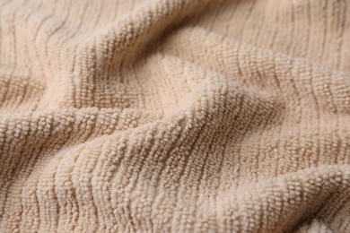 Clean beige microfiber cloth as background, closeup