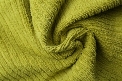 Photo of Clean green microfiber cloth as background, top view