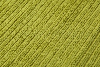 Photo of Clean green microfiber cloth as background, closeup