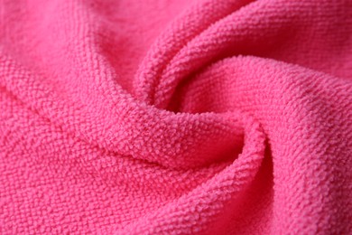 Clean pink microfiber cloth as background, closeup