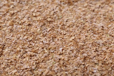 Pile of buckwheat bran as background, closeup