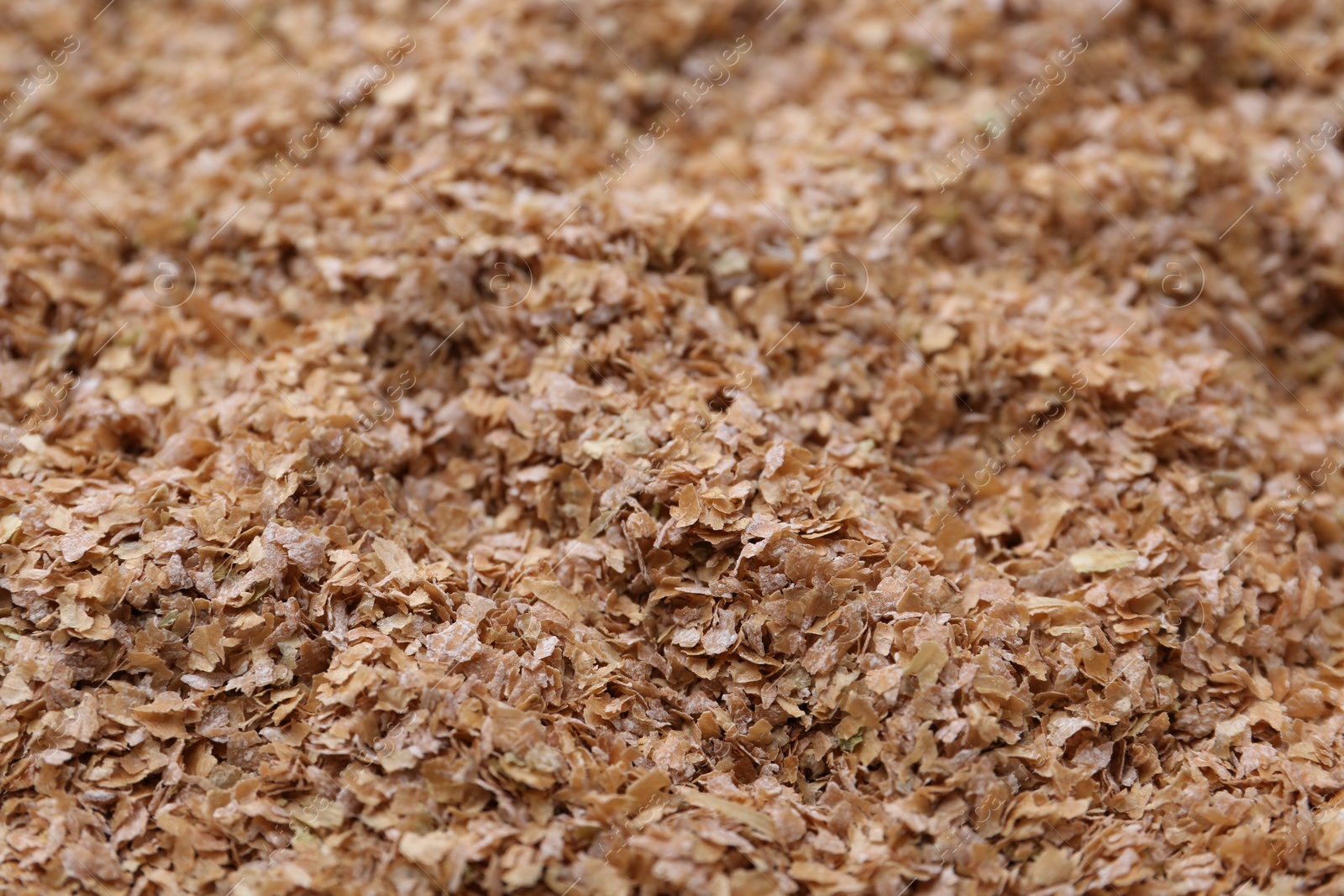 Photo of Pile of buckwheat bran as background, closeup