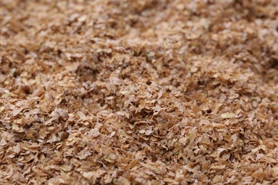 Pile of buckwheat bran as background, closeup