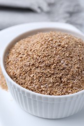 Photo of Buckwheat bran in bowl on table, closeup