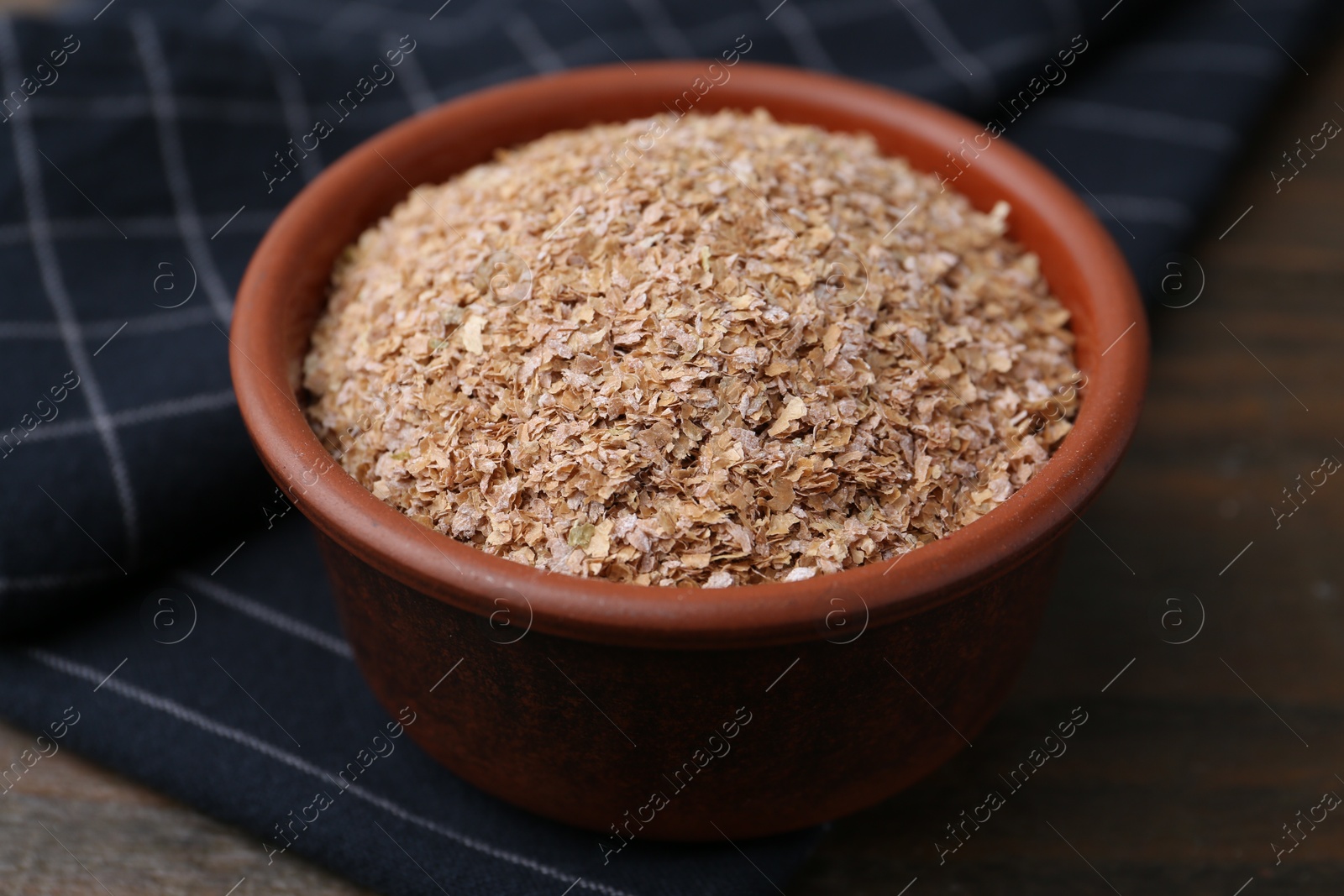 Photo of Buckwheat bran in bowl on table, closeup