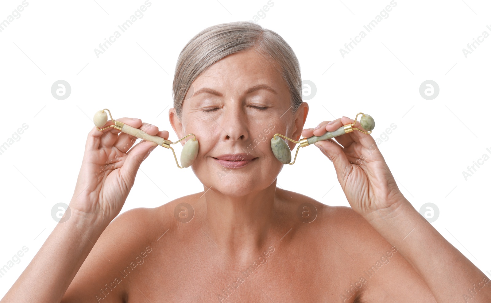 Photo of Beautiful woman doing facial massage with rollers on white background