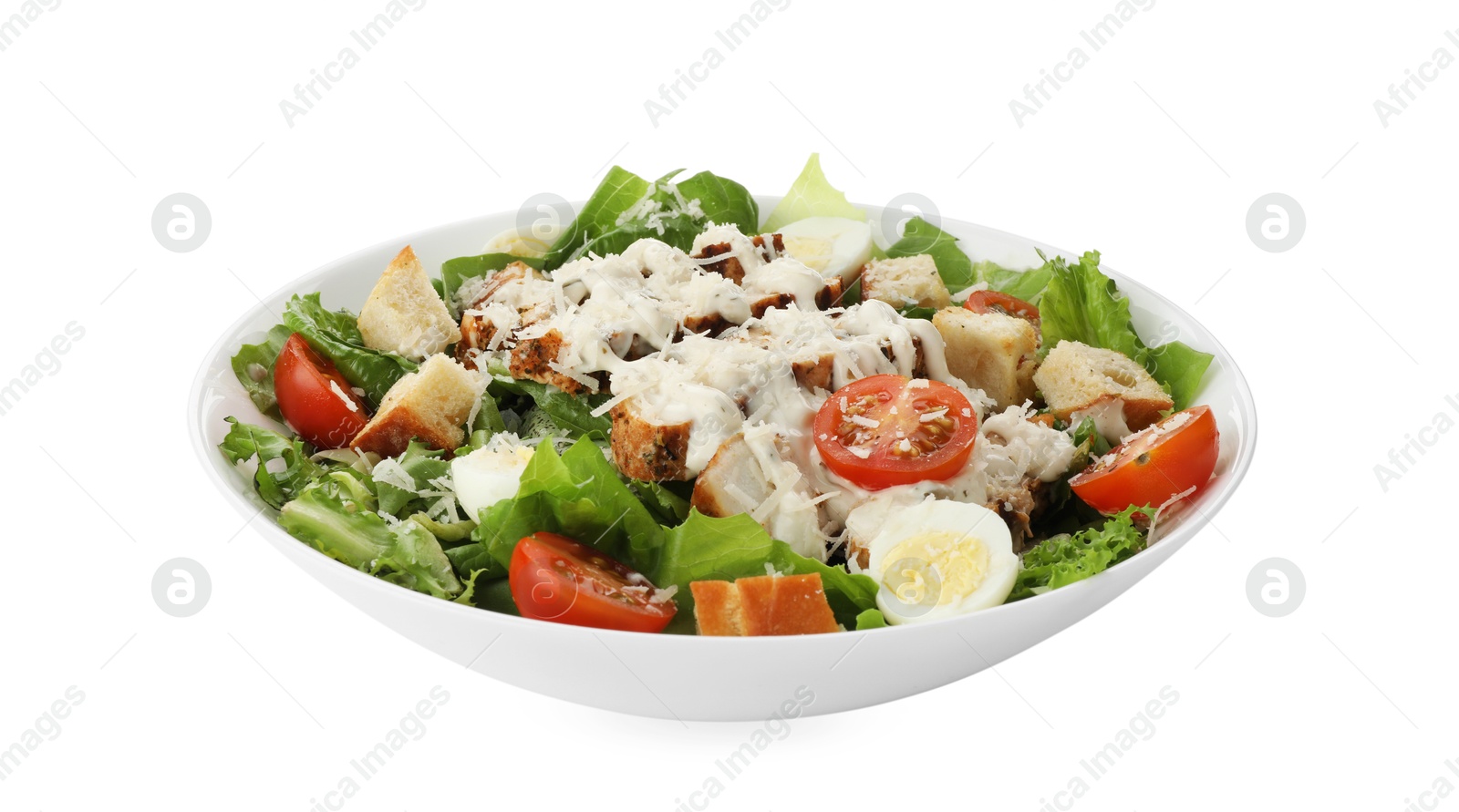 Photo of Tasty Caesar salad with chicken and tomatoes in bowl isolated on white