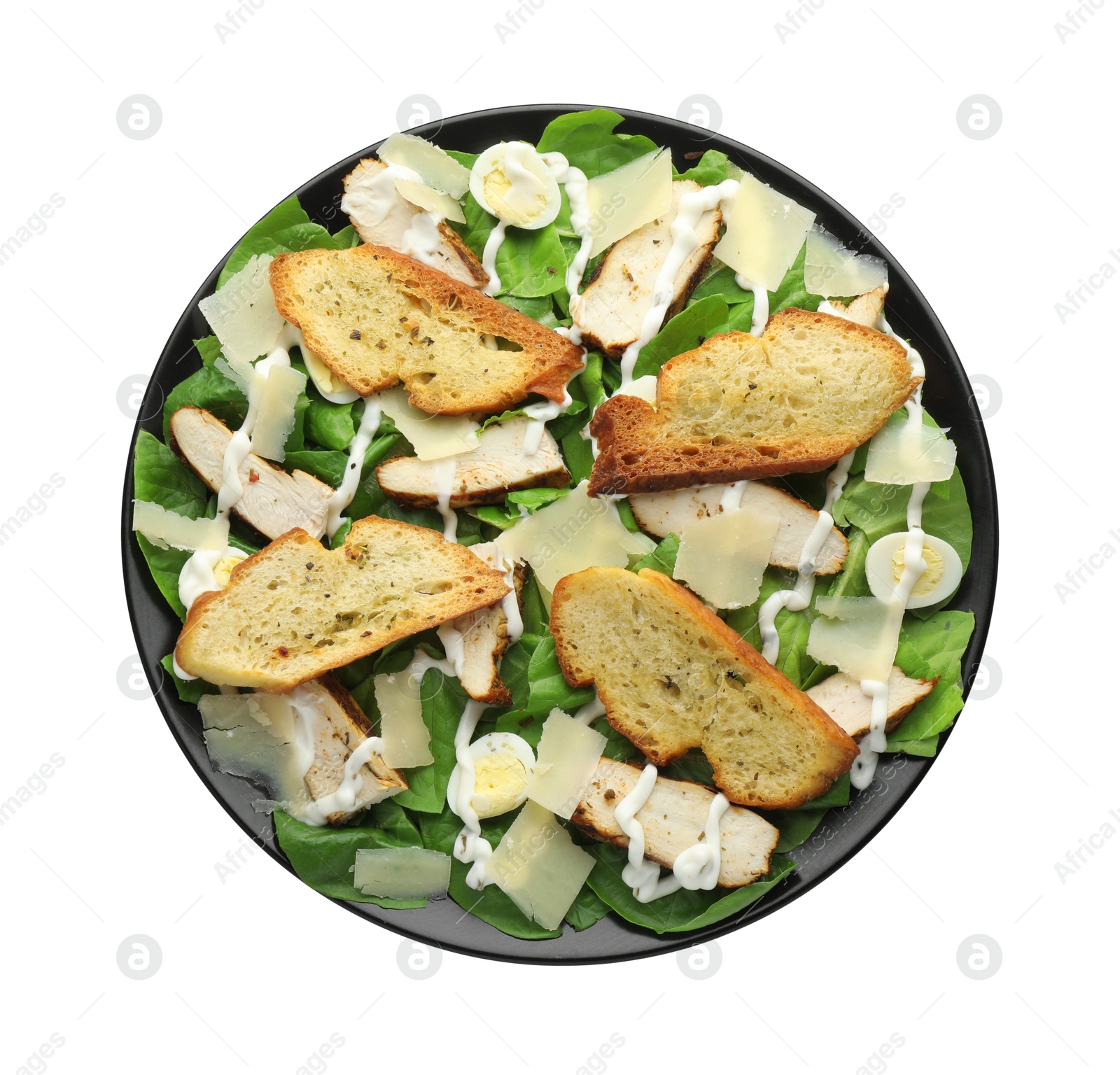 Photo of Delicious Caesar salad with chicken isolated on white, top view