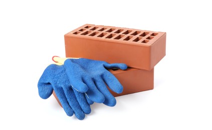 Red bricks and gloves on white background