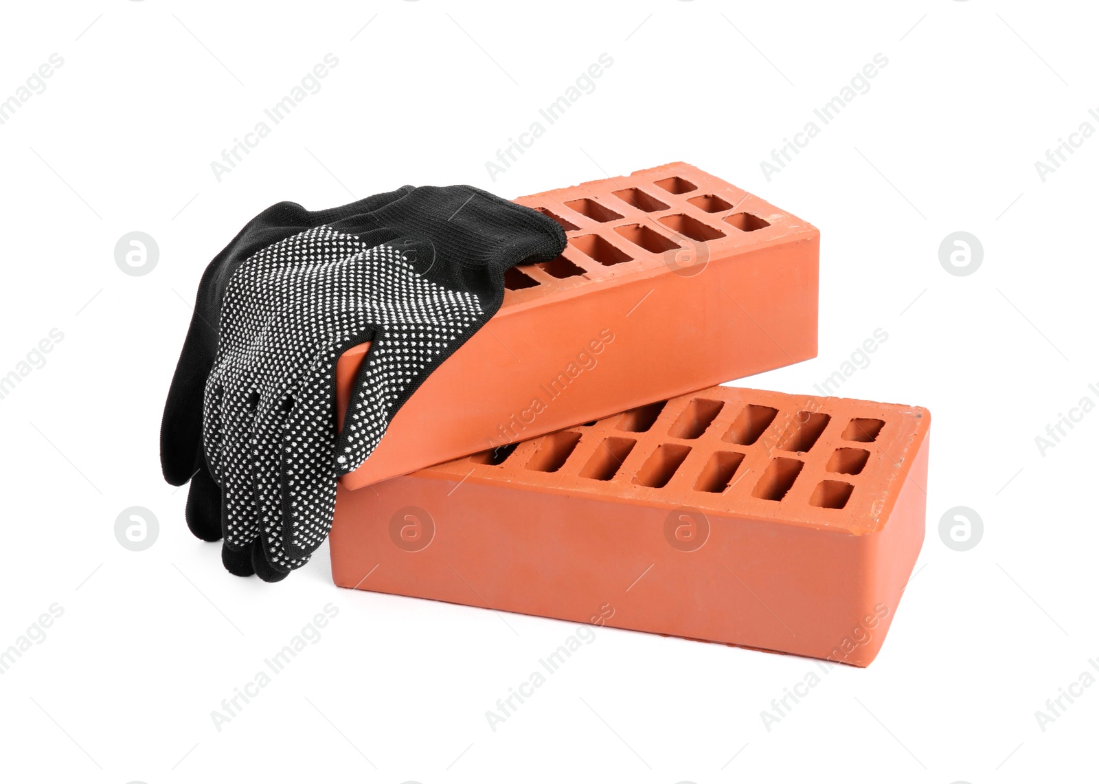 Photo of Red bricks and glove on white background