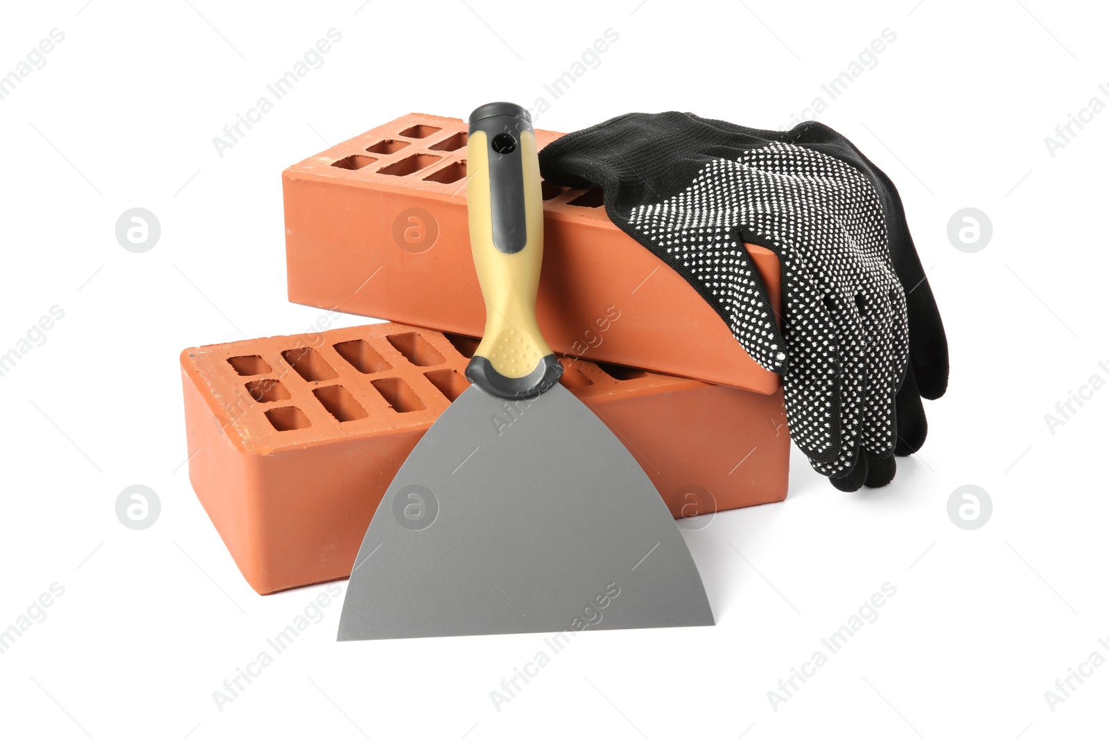 Photo of Red bricks, glove and trowel on white background