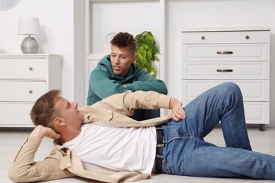 Young brothers spending time together at home