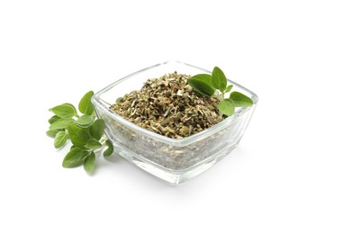 Photo of Dried oregano in glass bowl and green leaves isolated on white