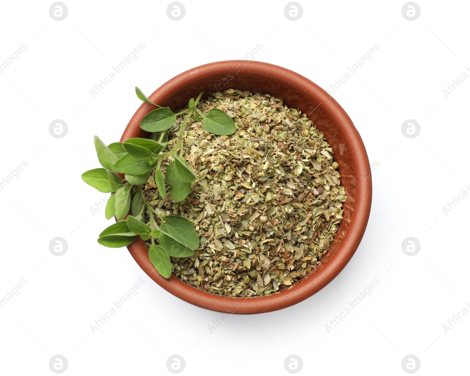 Photo of Dried oregano in bowl and green leaves isolated on white, top view