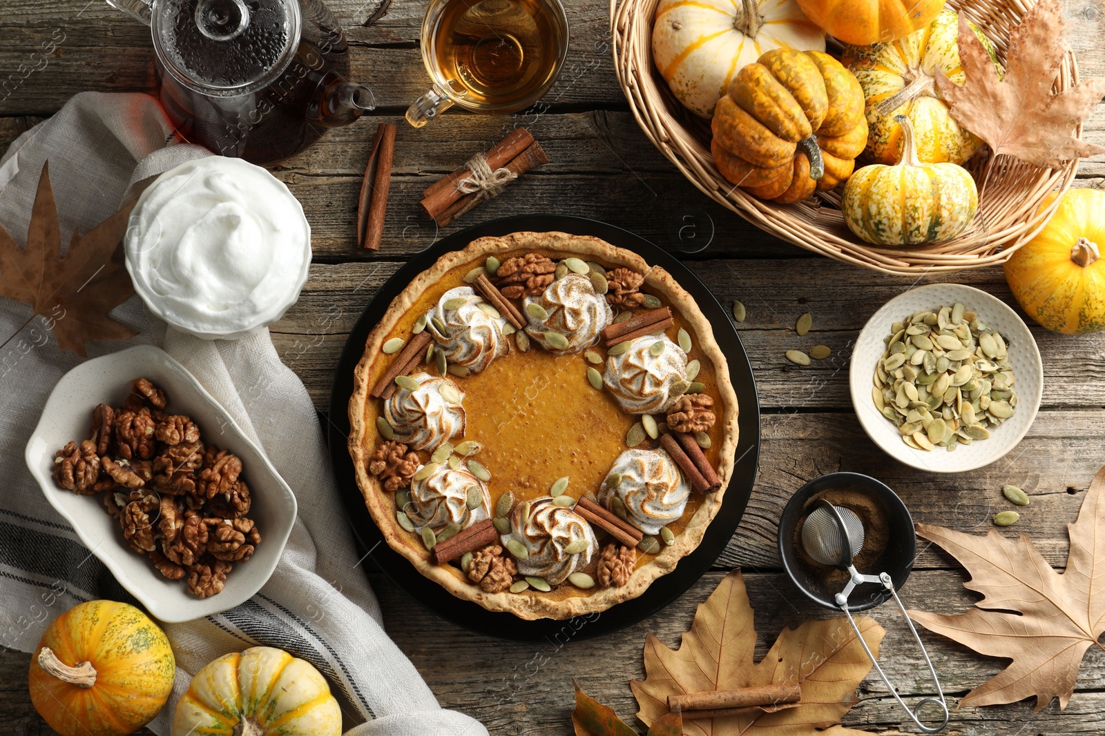 Photo of Flat lay composition with homemade pumpkin pie on wooden table