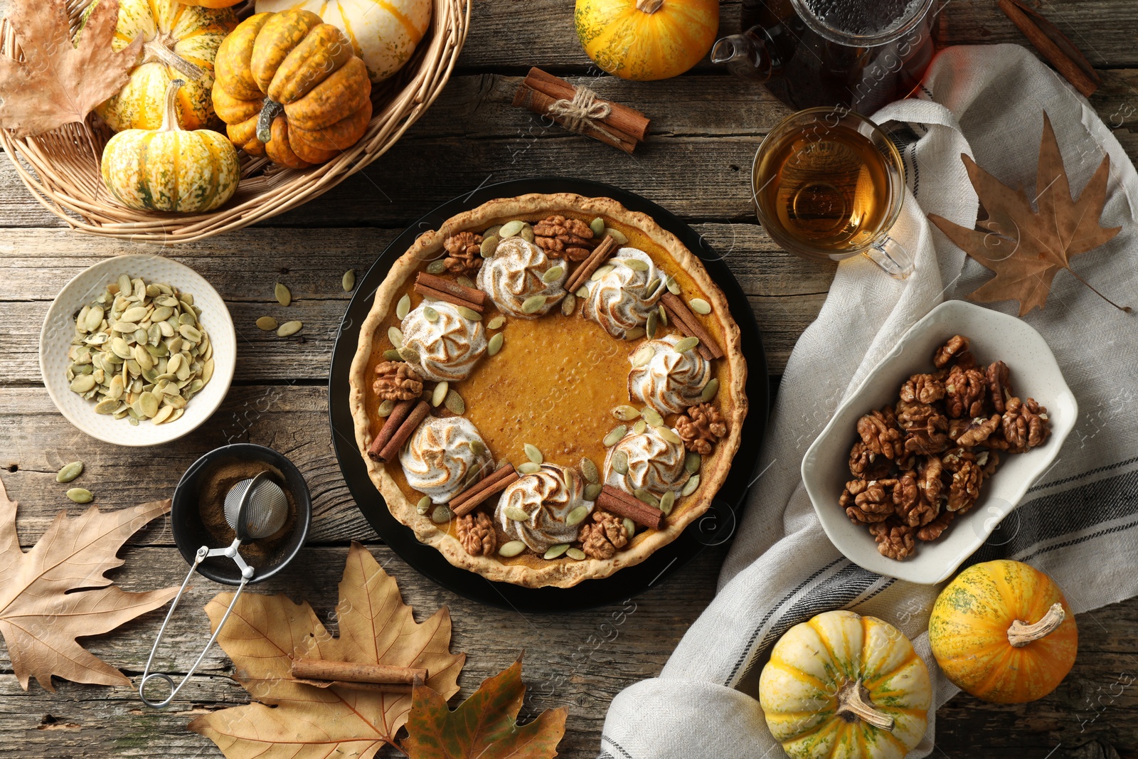 Photo of Flat lay composition with homemade pumpkin pie on wooden table