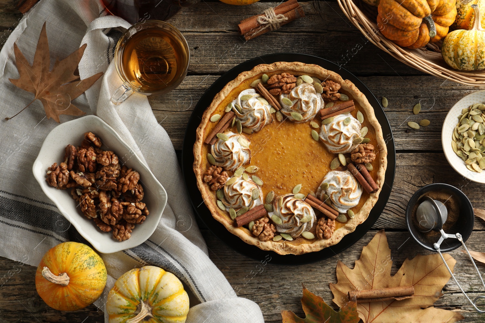 Photo of Flat lay composition with homemade pumpkin pie on wooden table