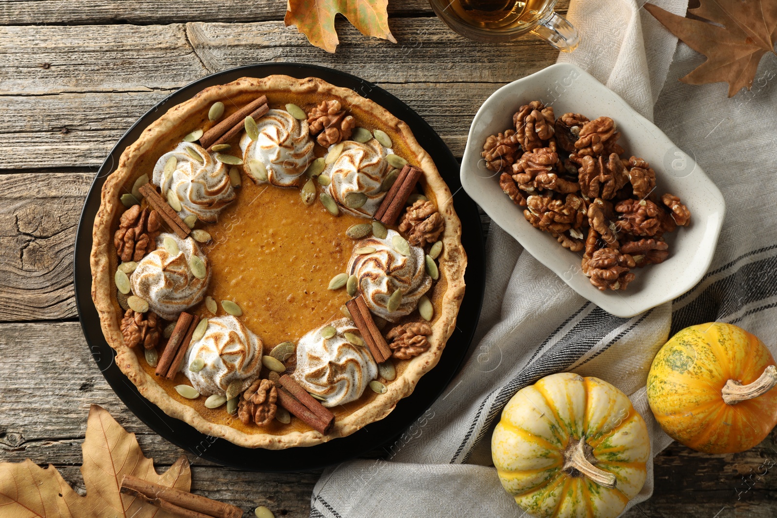 Photo of Flat lay composition with homemade pumpkin pie on wooden table